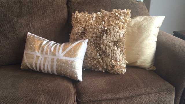 Sally Moore Home Staging lighten a room with pillows